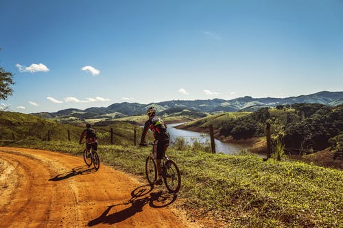 cyclists-trail-bike-clouds-163407